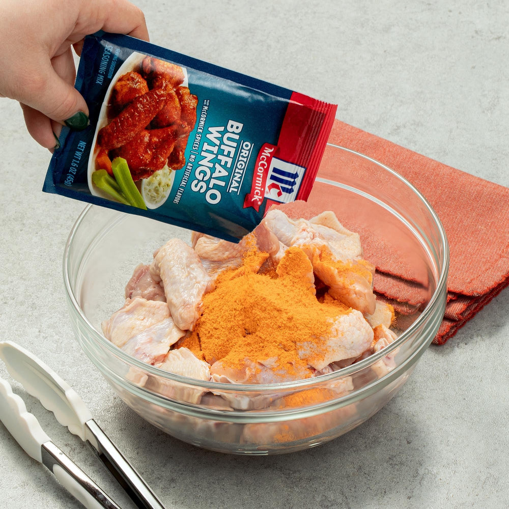Stacked McCormick 1.6 oz packs in pantry for convenient bulk use
