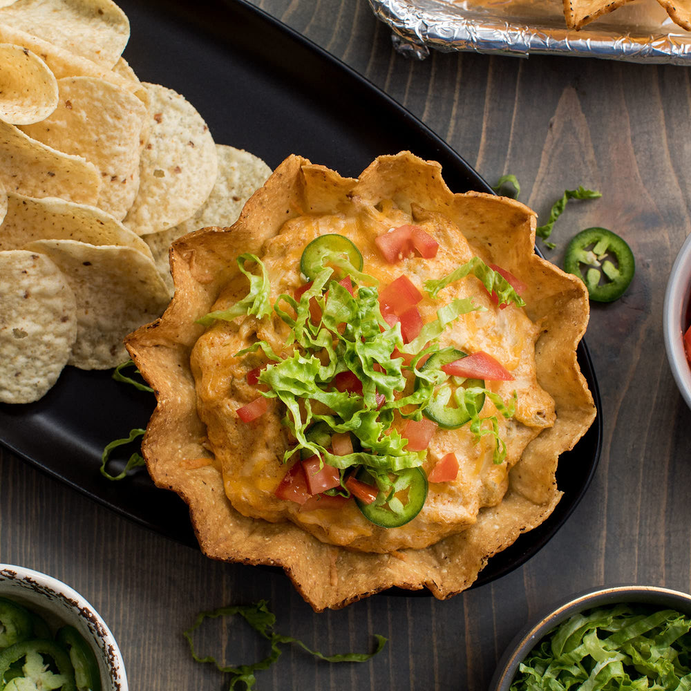 Family enjoying tacos at table using McCormick mix for simple, crowd-pleasing dinner