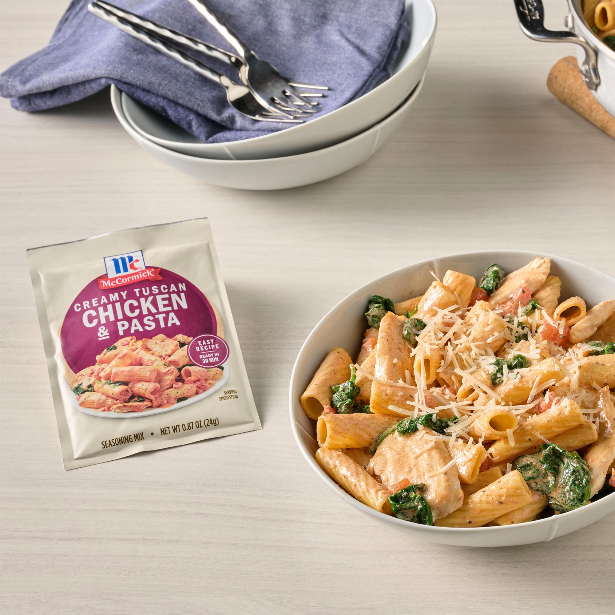 Prepared Tuscan chicken and pasta top-down view with McCormick mix, ready to serve