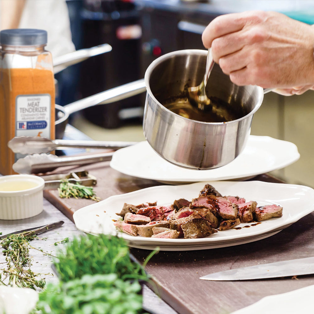 McCormick Culinary being applied to steak before cooking showing tenderizing benefit
