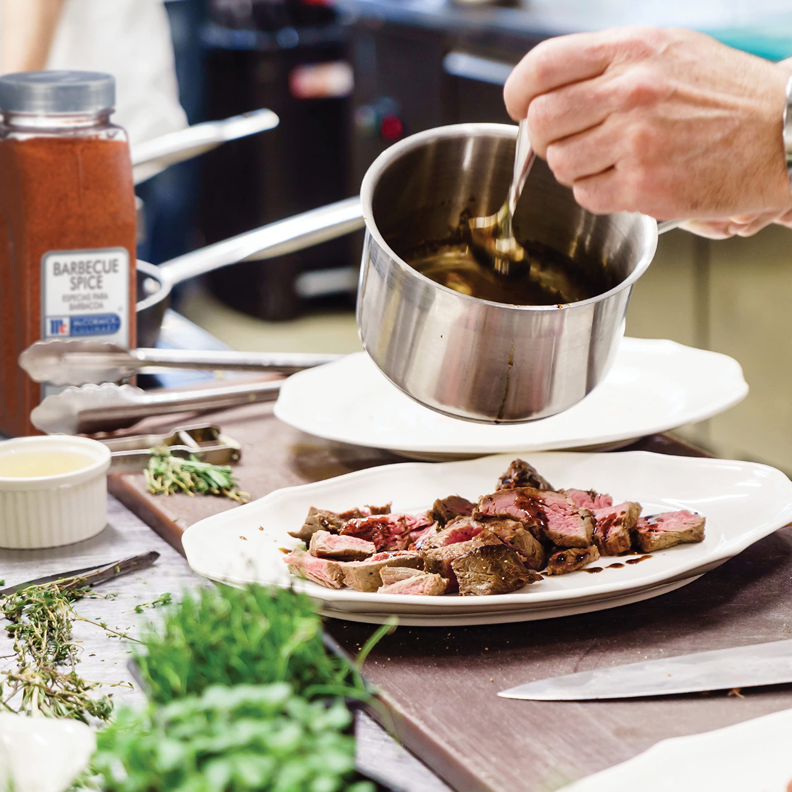 McCormick Culinary 18 oz container beside a chef's hand showing commercial scale