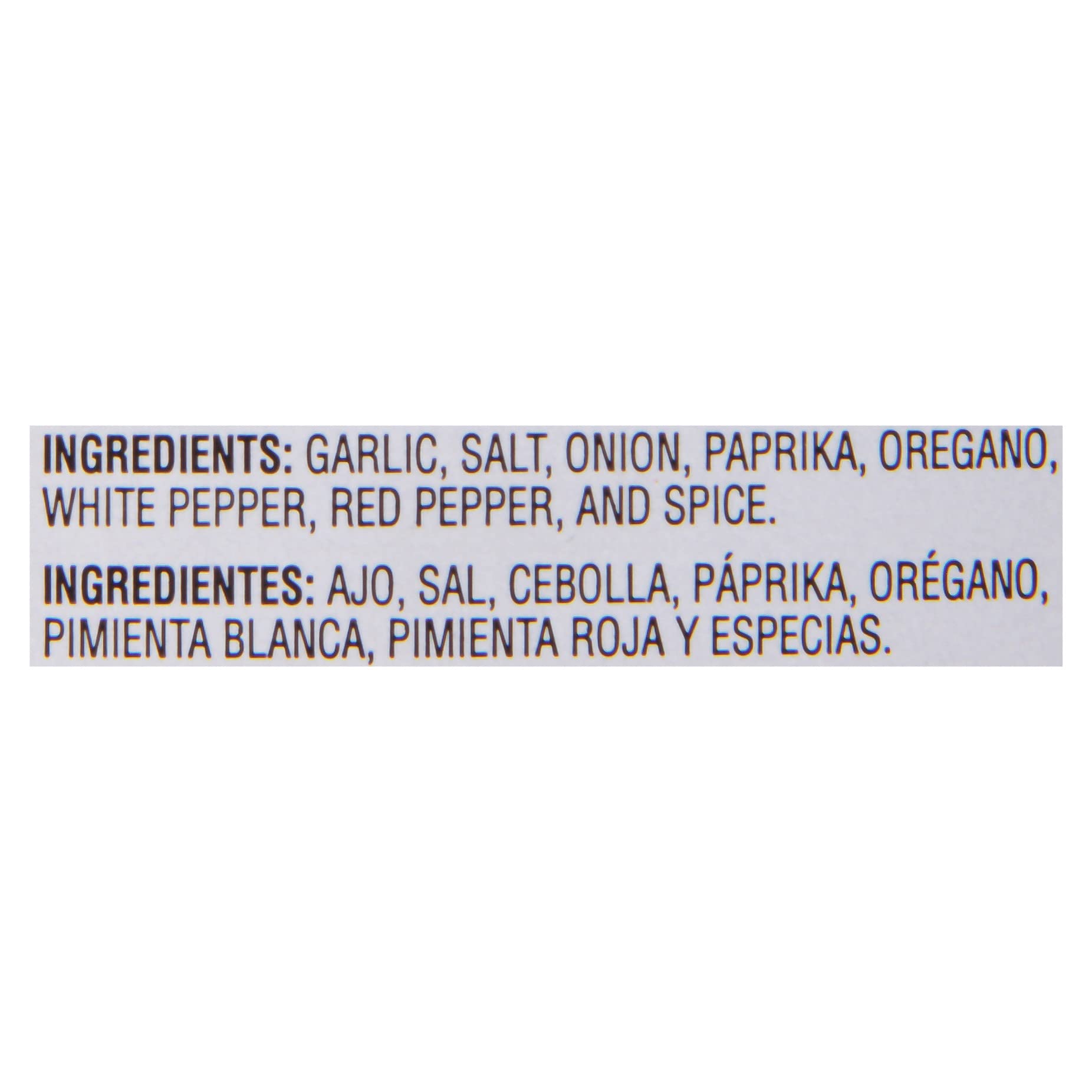 Chef in a commercial kitchen using McCormick Culinary Cajun to season a large tray