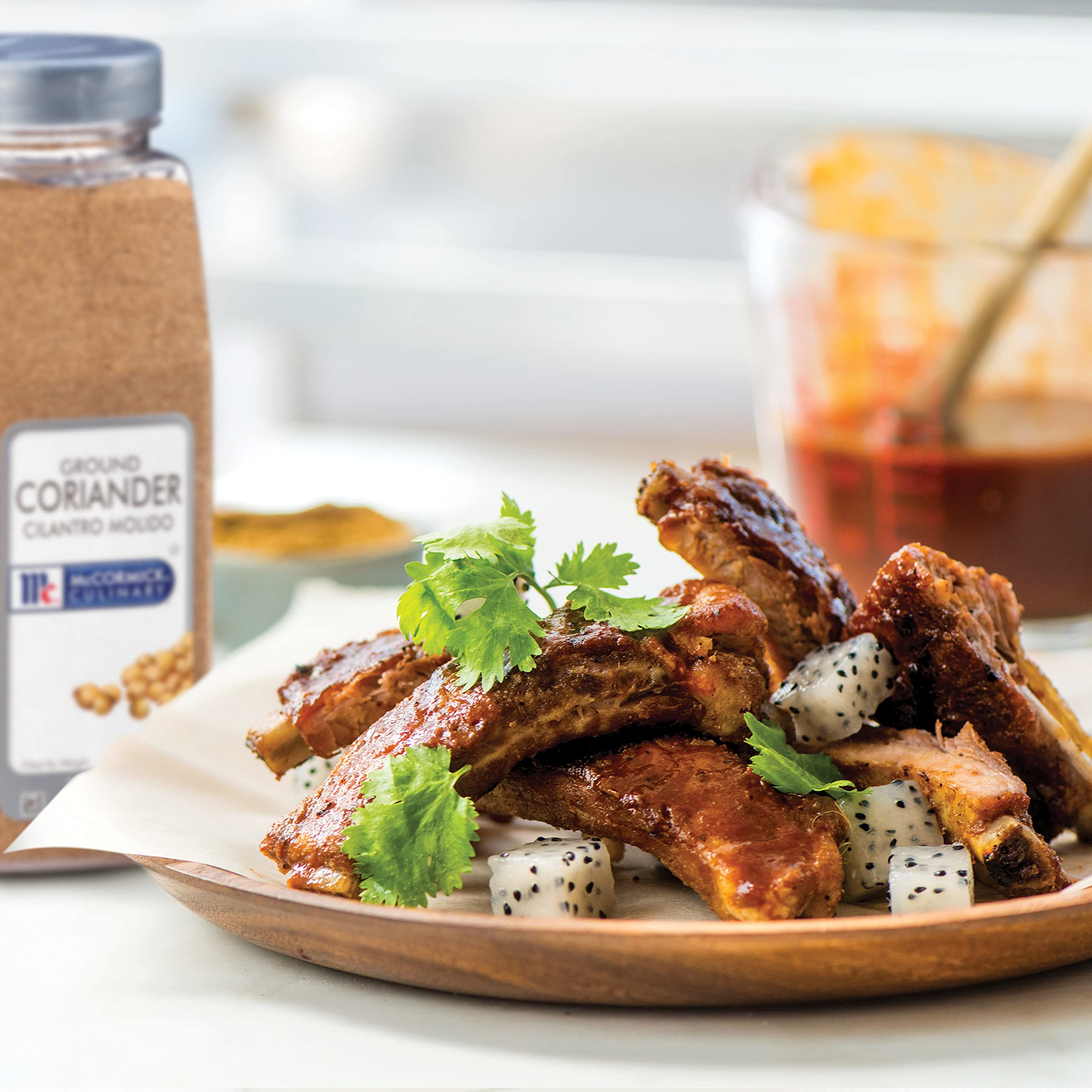 McCormick Culinary coriander sprinkled on curry adding bright citrus lift to dish