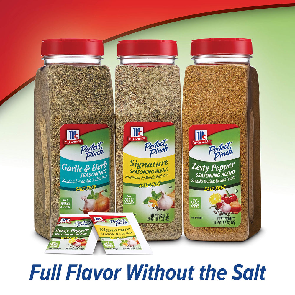 Tabletop shaker of McCormick seasoning placed with salt and pepper for customizable dining