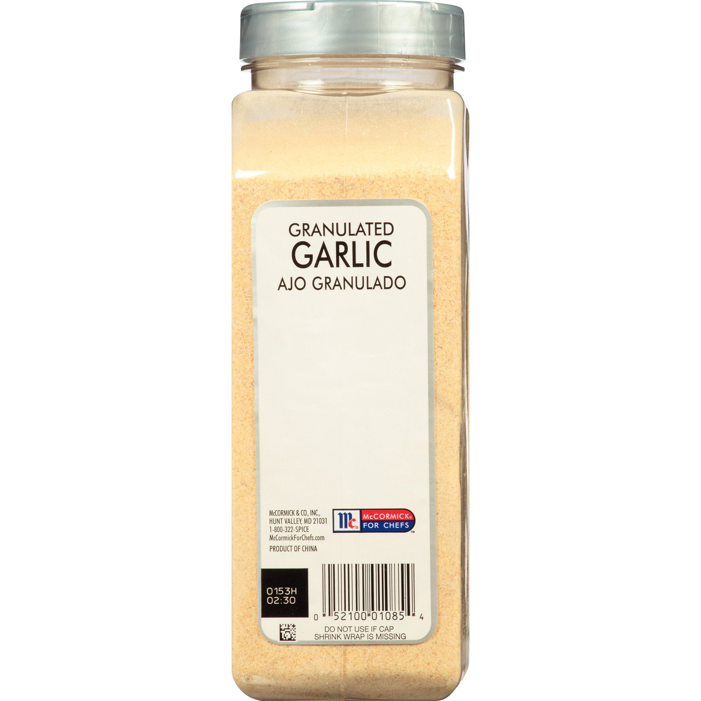 McCormick Culinary granulated garlic poured from spoon showing easy dosing benefit