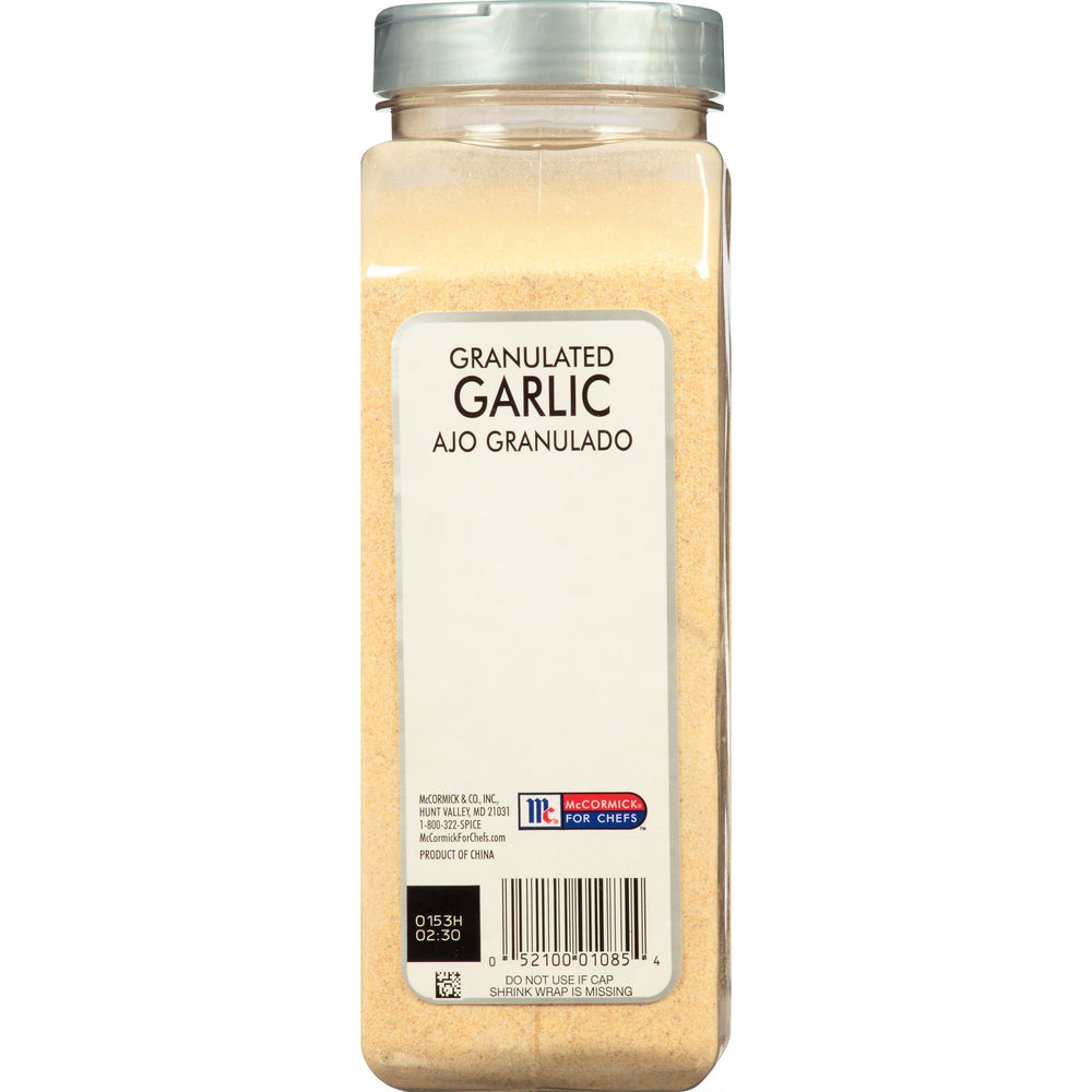 McCormick Culinary granulated garlic poured from spoon showing easy dosing benefit