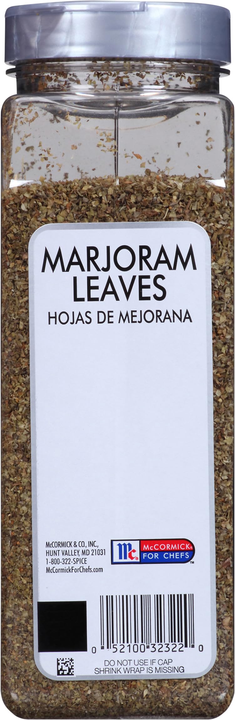 chef adding McCormick marjoram to skillet in kitchen showing professional use