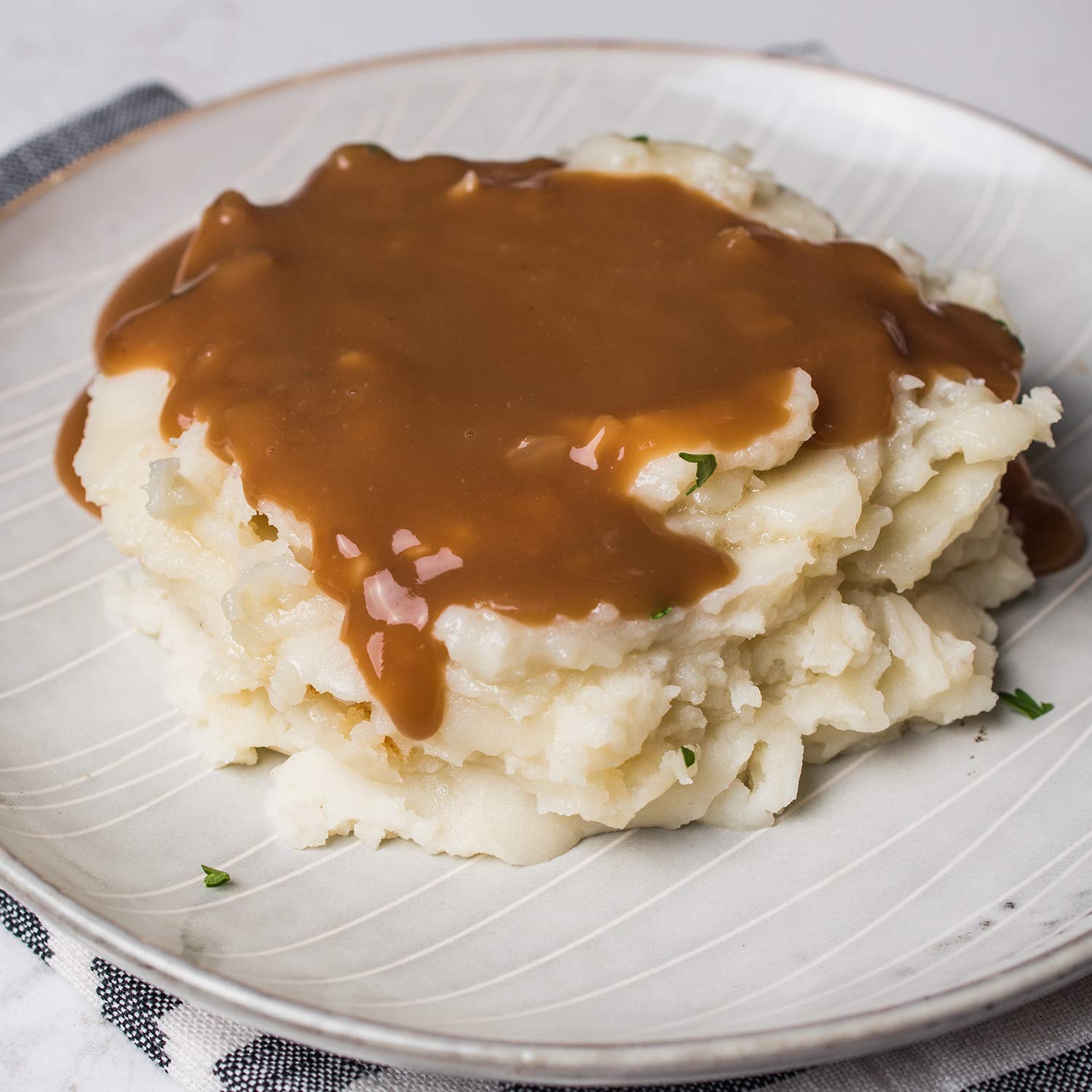 McCormick spices and packet beside fresh onions highlighting robust flavor