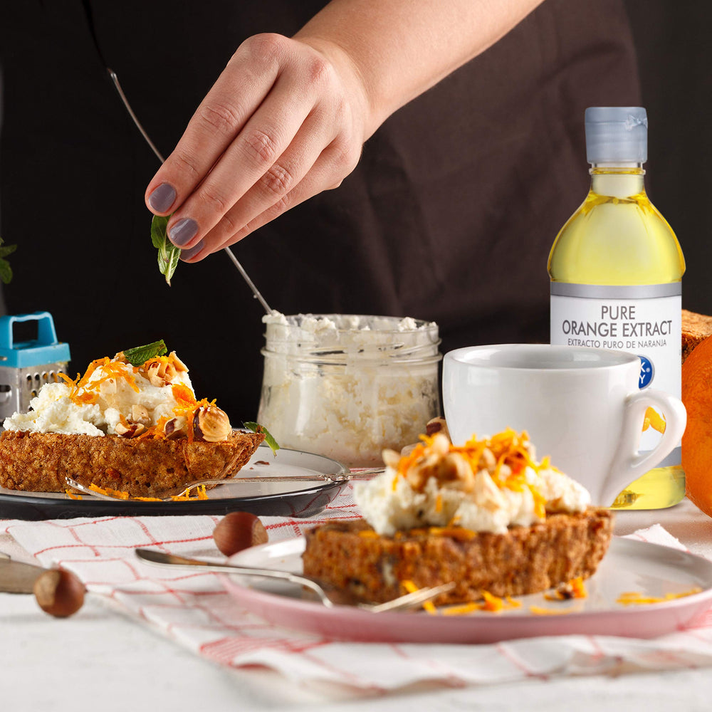 McCormick Culinary orange extract splashing into a cocktail to boost citrus character