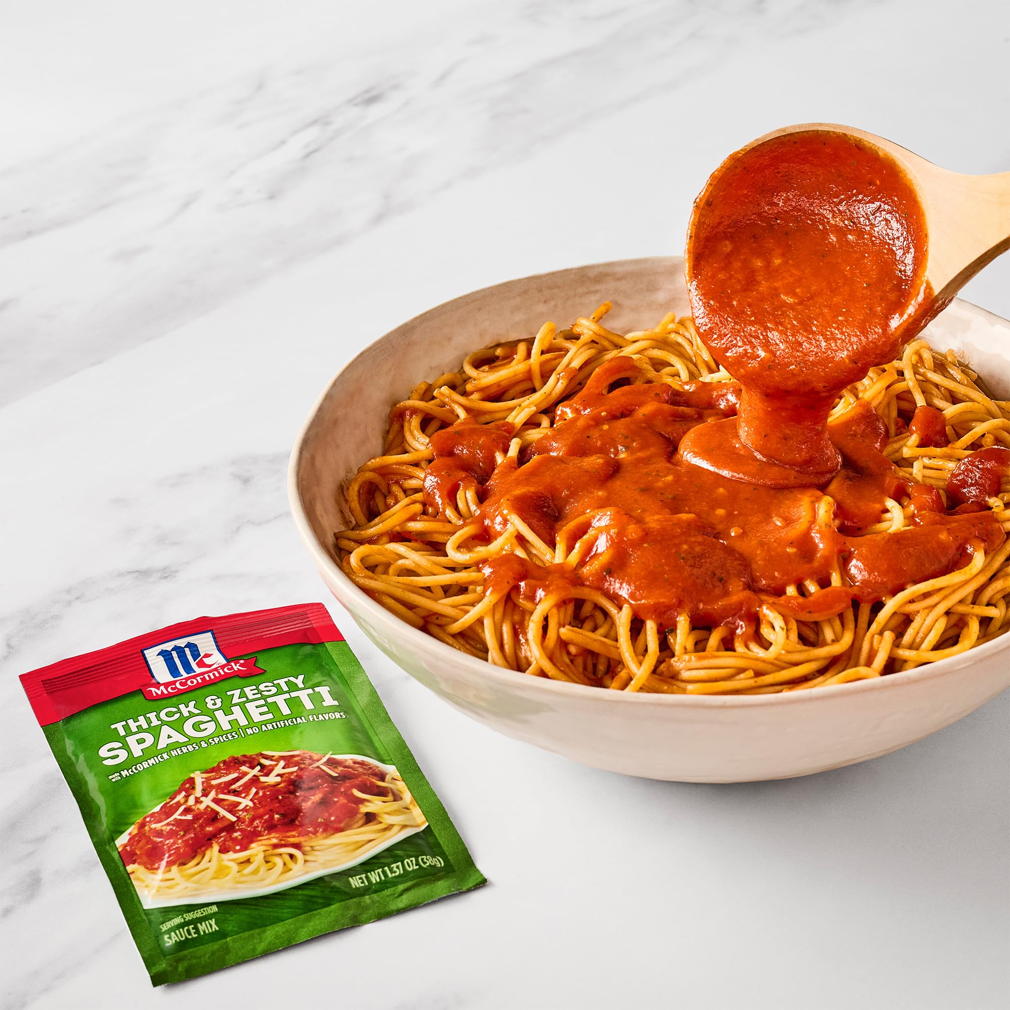 McCormick packet next to a measuring spoon showing compact pantry convenience