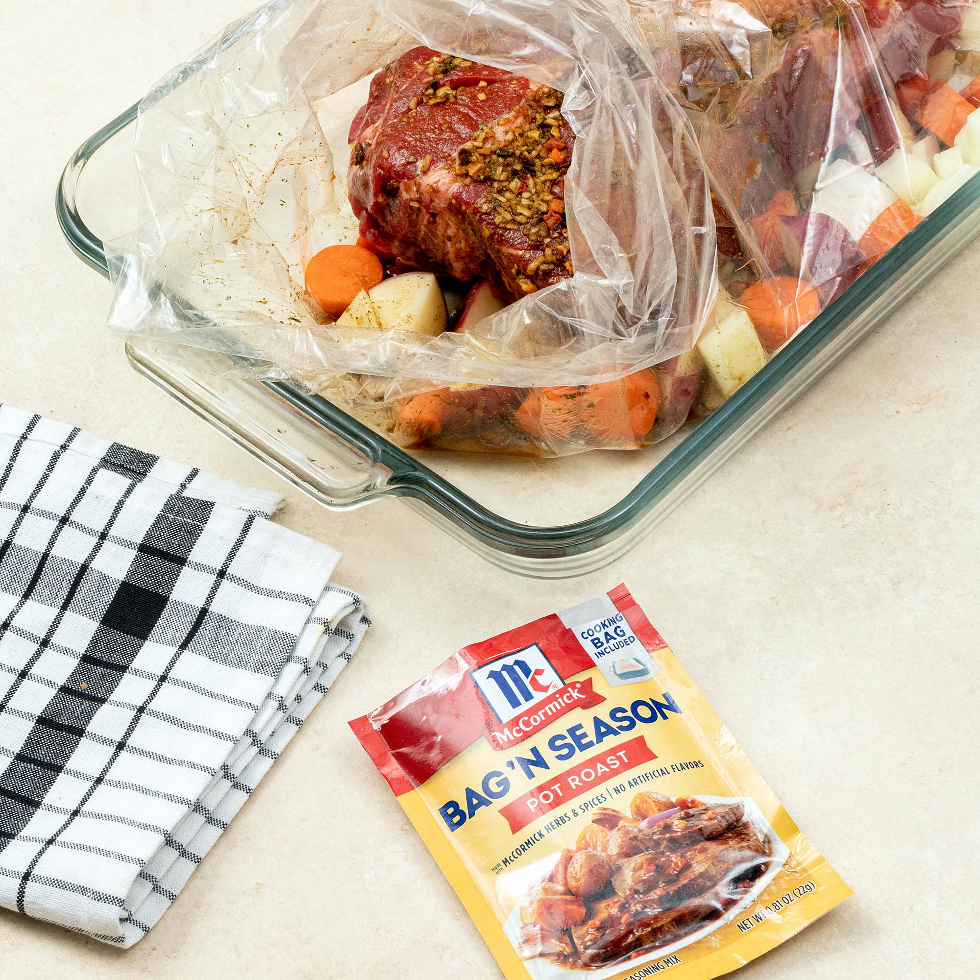 McCormick packet next to raw roast showing suggested roast size