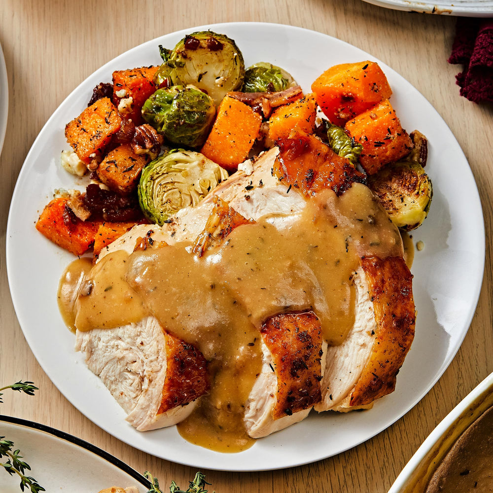 McCormick turkey gravy poured over mashed potatoes, enhances dinner flavor instantly