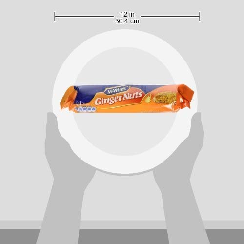 McVitie's ginger nut being dunked in tea showing sturdy biscuit and soak resilience