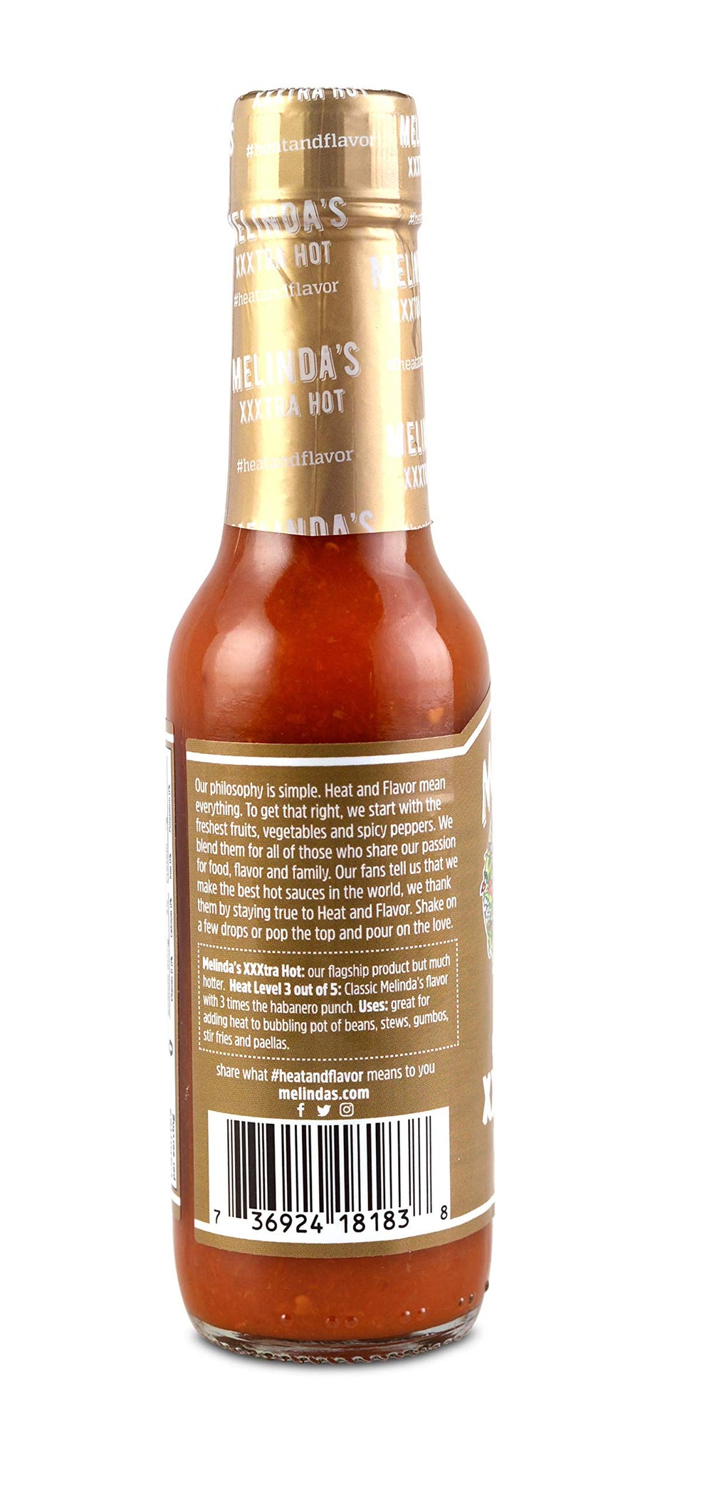 Melinda's 5oz bottle next to spoon showing compact size and easy portioning