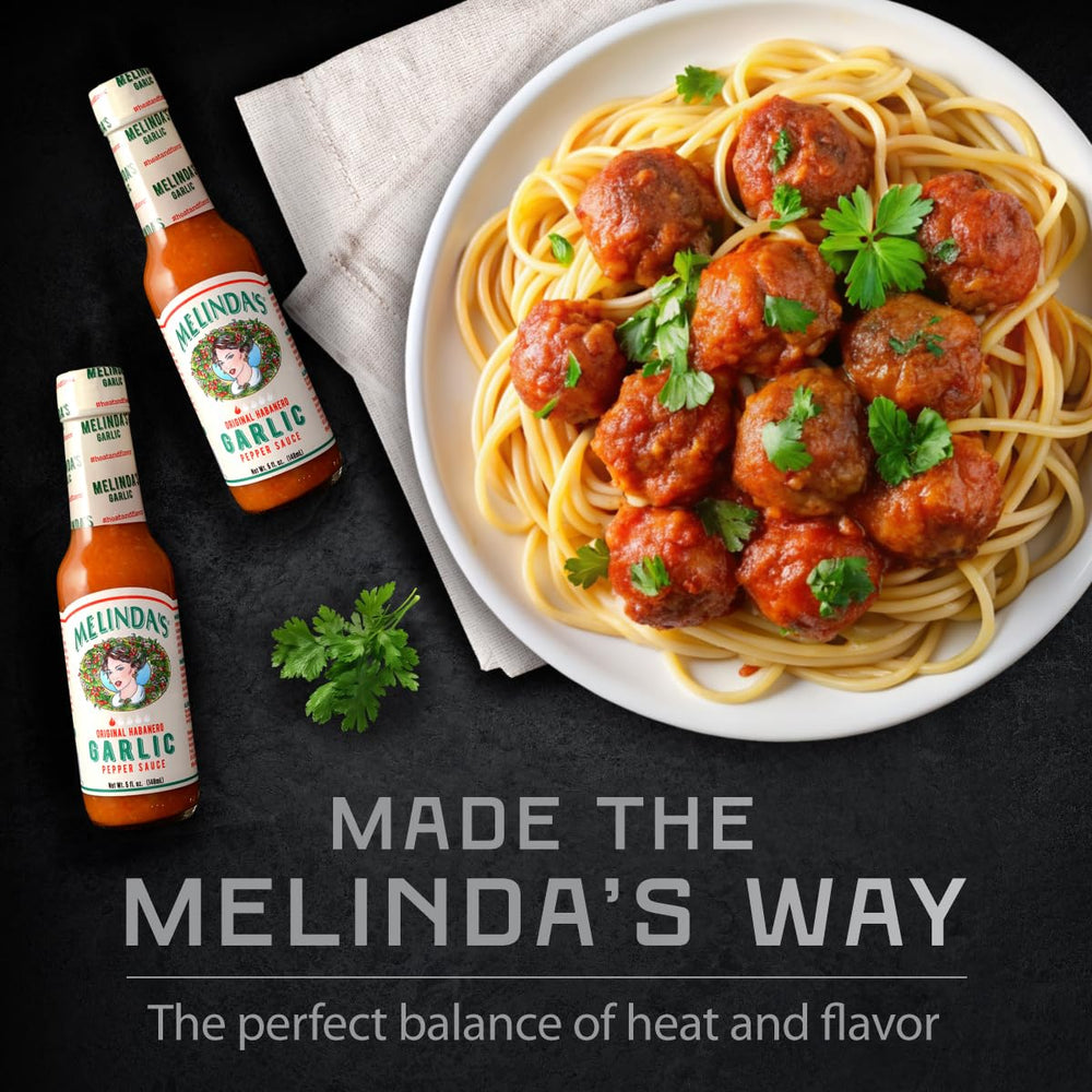 Melinda's bottle beside an outdoor grill scene, pairs with grilled meats and veggies