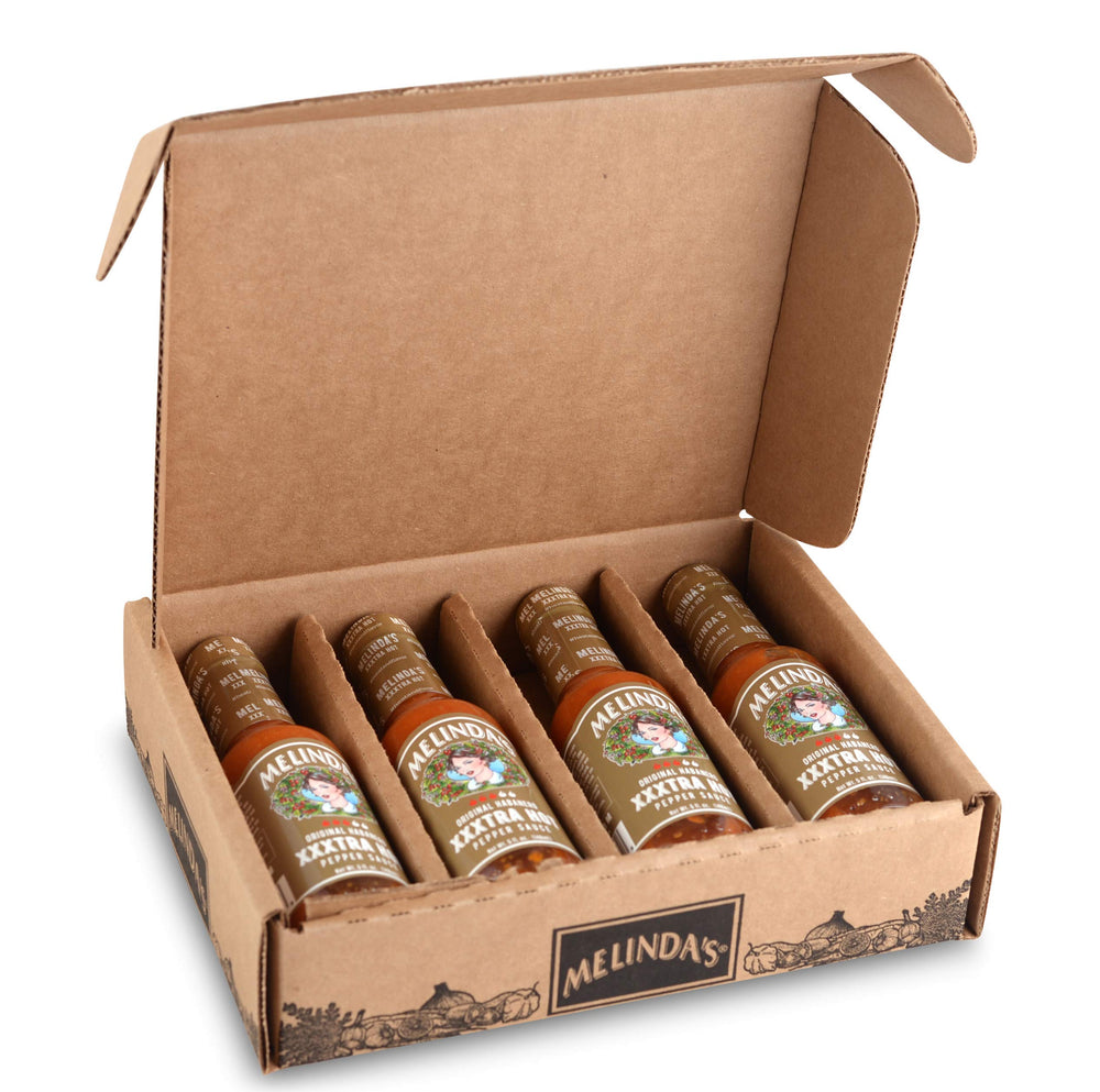 Melinda's front bottle shot showing label and bright orange sauce benefits bold flavor