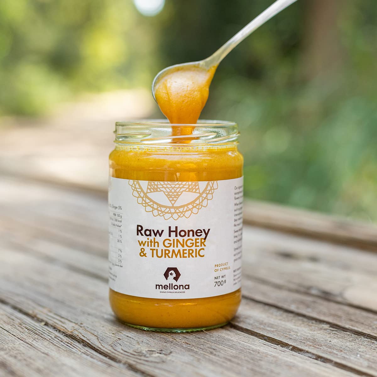 Mellona honey creamy texture on spoon highlighting spreadable consistency