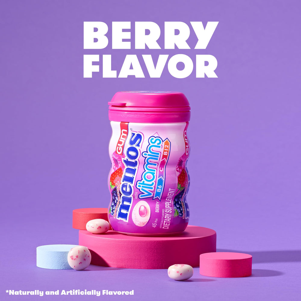 Open Mentos bottle with visible berry gum pieces ready to grab and chew