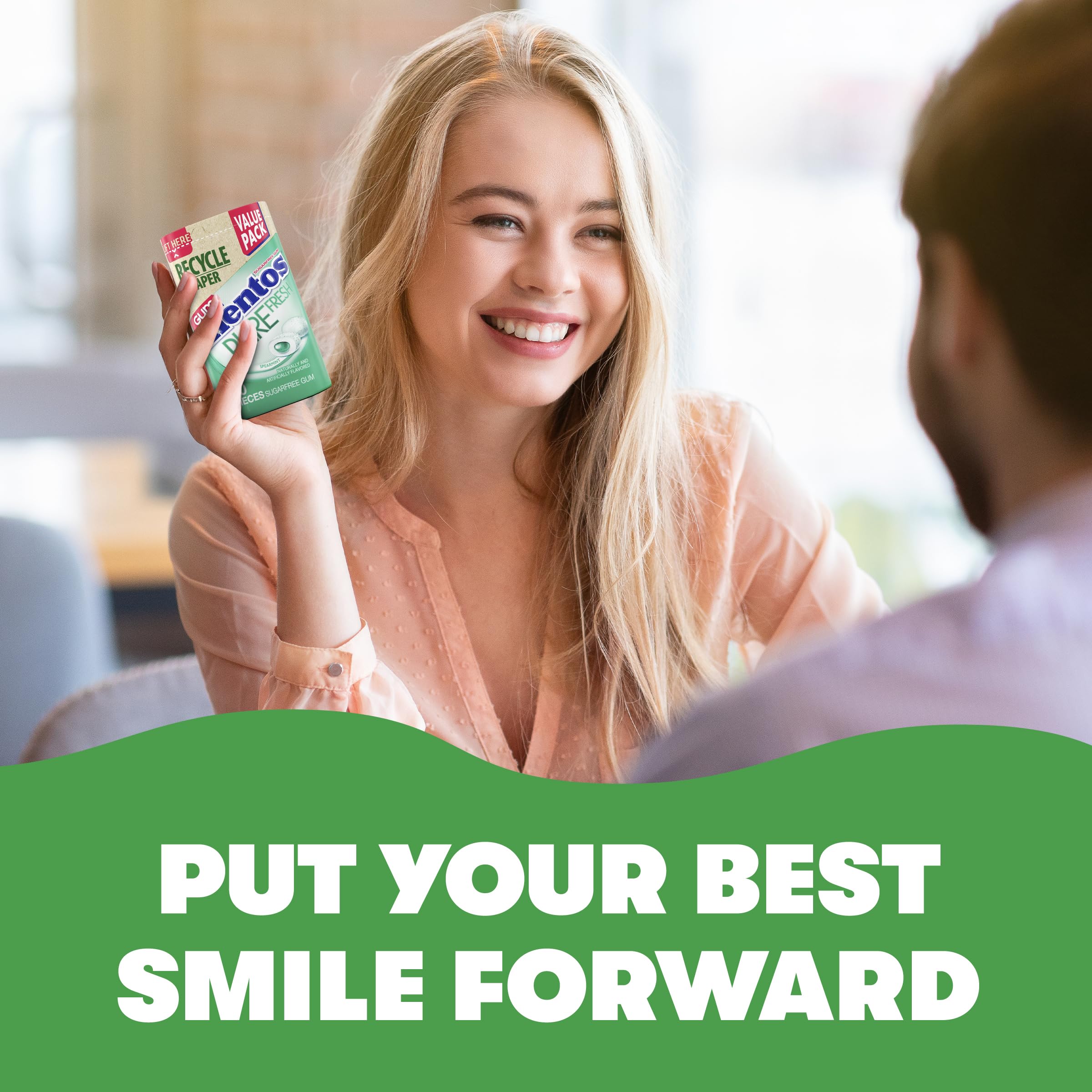 Mentos bottle in a pocket demonstrating travel-ready fresh breath benefit