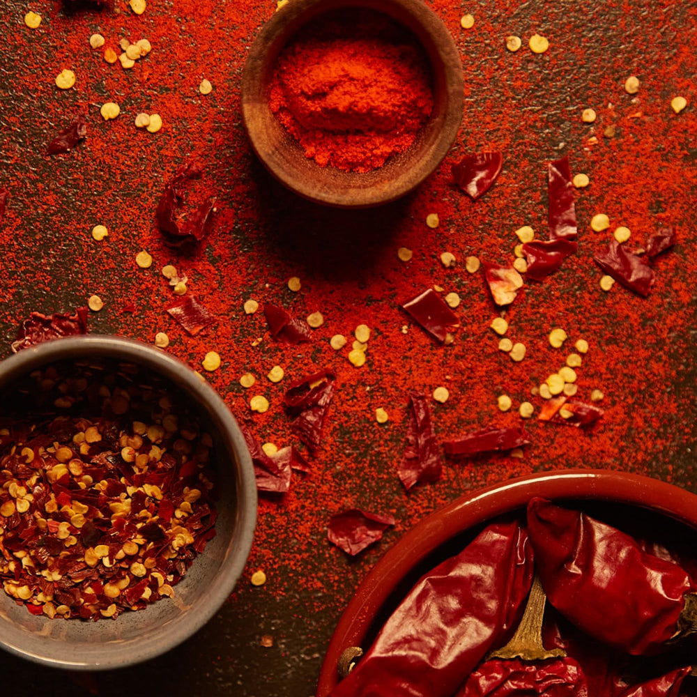 MEROPS ingredient flatlay with peppers and herbs illustrating natural sourcing benefit: clean label