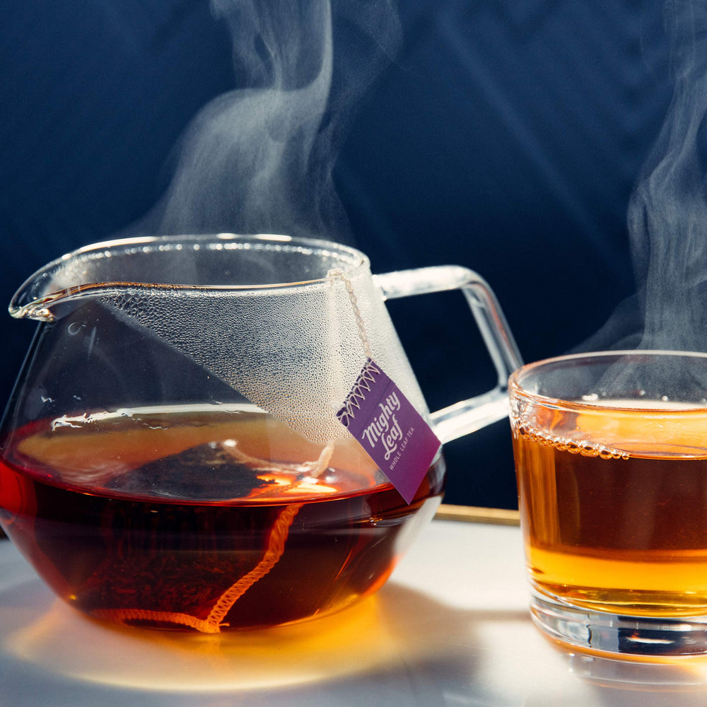 Mighty Leaf brewed cup in kitchen lifestyle scene highlighting rich color and aroma