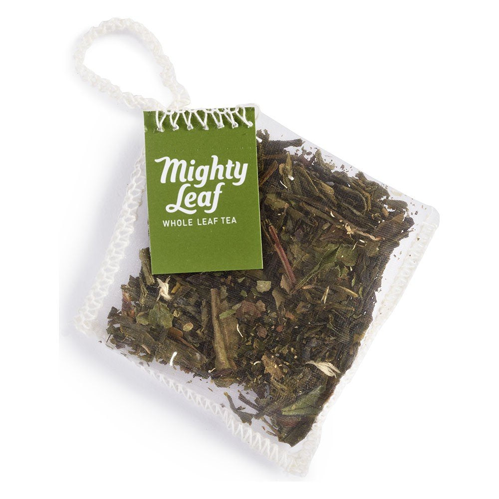 Mighty Leaf close-up of biodegradable mesh pouch with whole-leaf tea, boosts flavor release