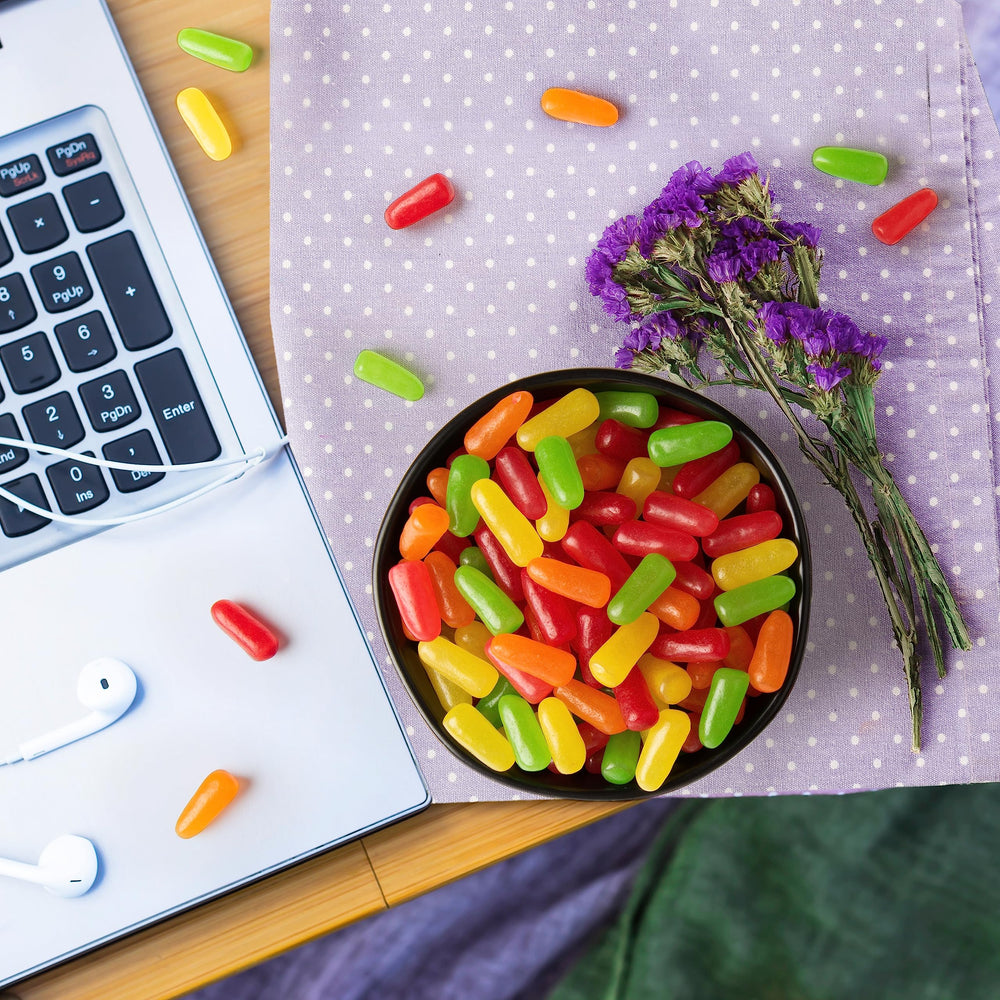 MIKE AND IKE theater box next to phone showing portable snack size