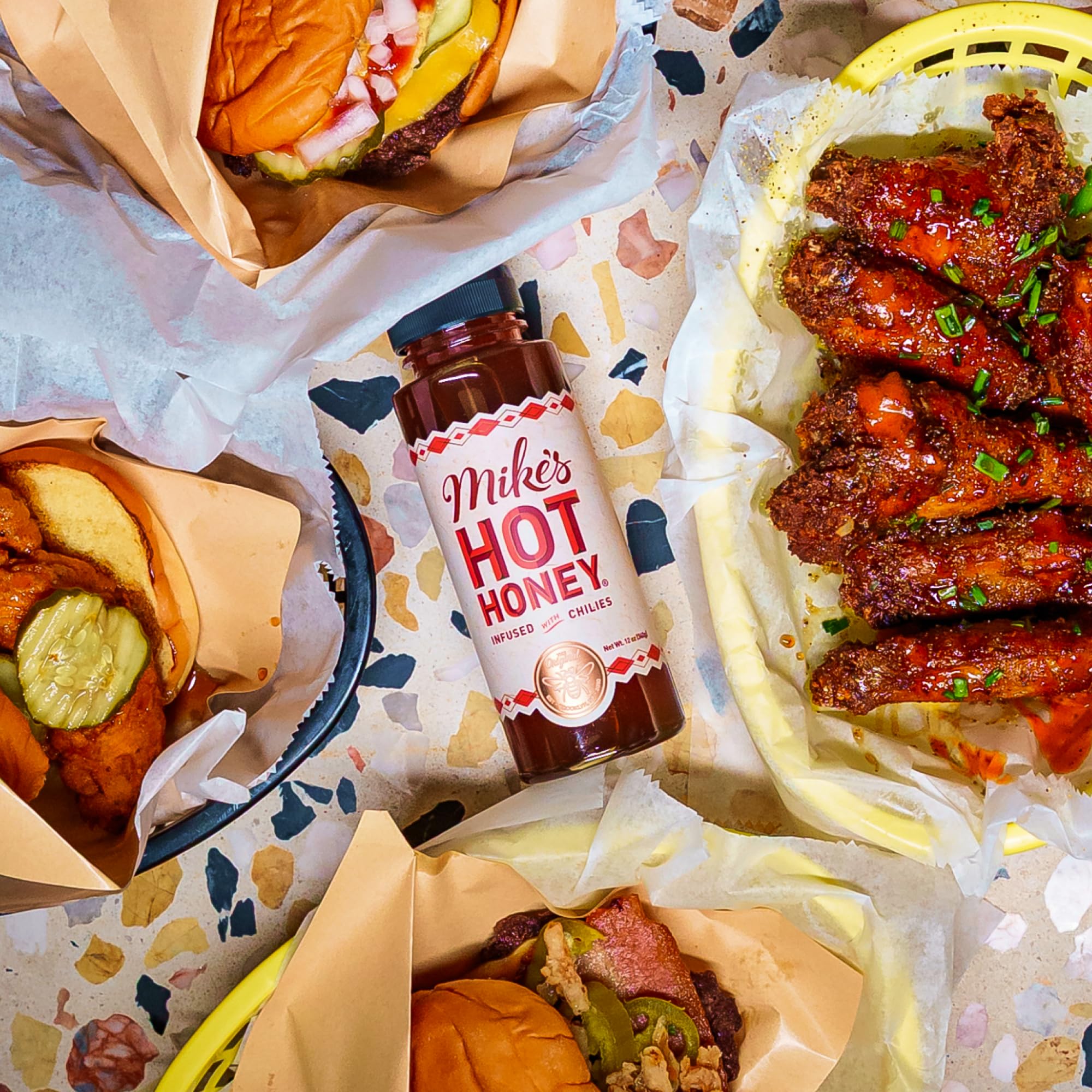 Mike's Hot Honey drizzled on fried chicken demonstrating crispy-sweet pairing