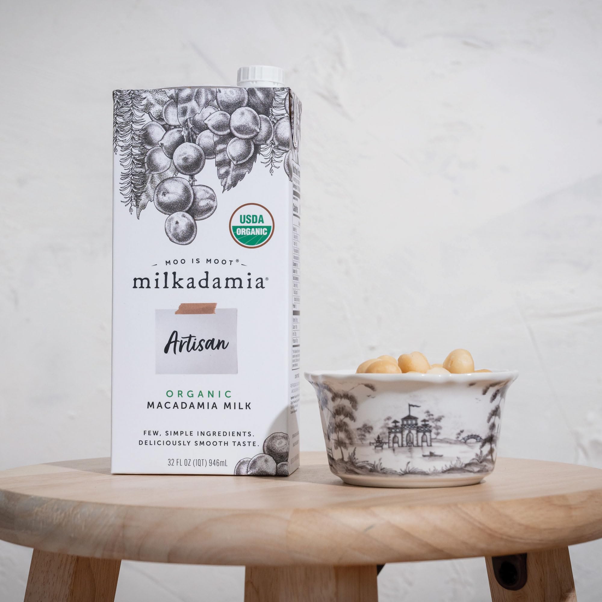 Milkadamia being poured into coffee demonstrating silky blendability
