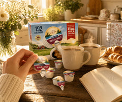 Mini Moo pod added to coffee cup demonstrating creamy blend benefit