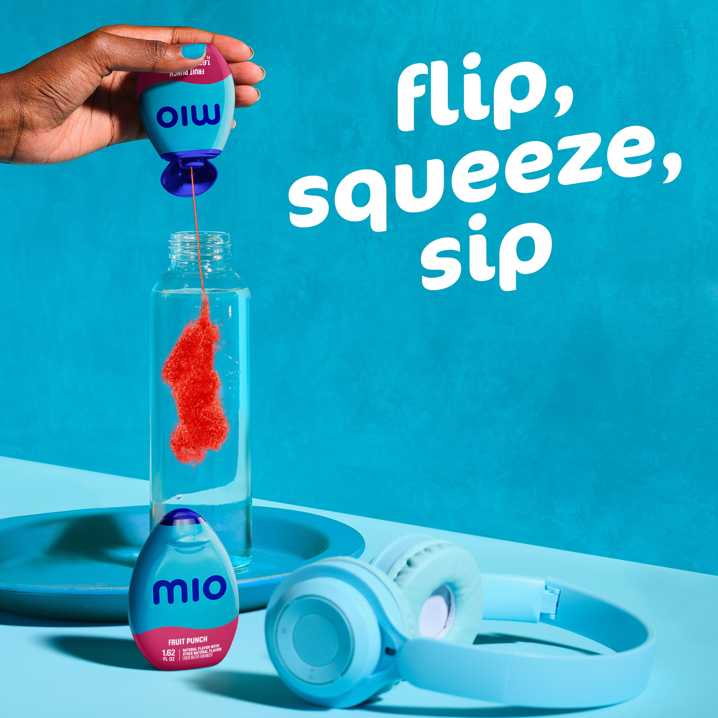 Mio Fruit Punch tucked into backpack pocket showing grab-and-go portability