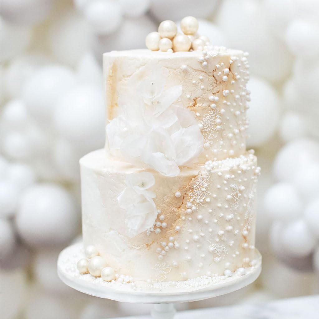 Mkostlich hand sprinkling pearls over cupcake demonstrating easy application benefit