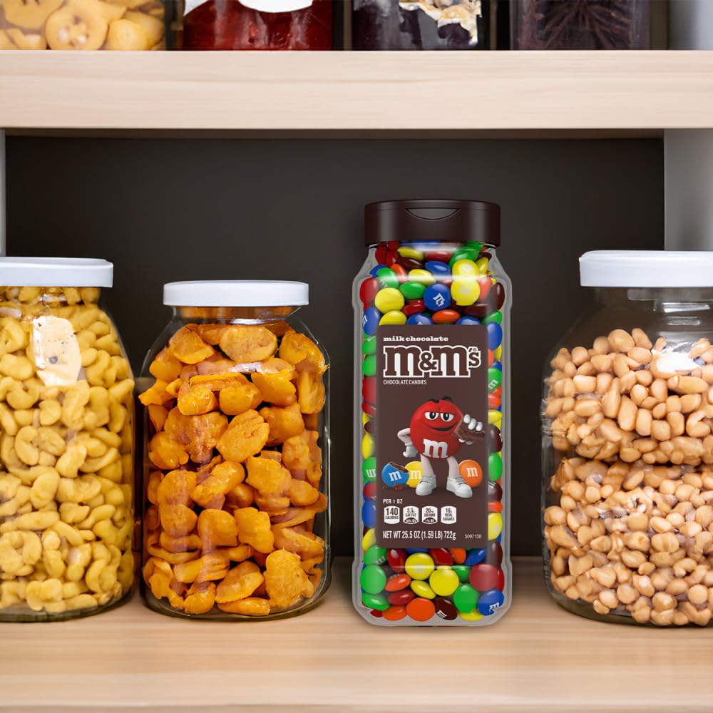 M&M's being mixed into cookie dough highlighting baking versatility and crunch