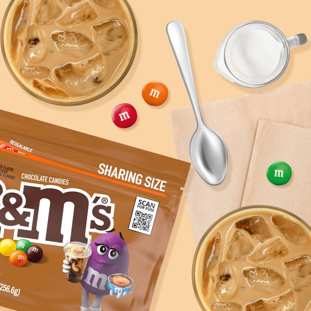 M&M'S in hand for size comparison showing portioning convenience