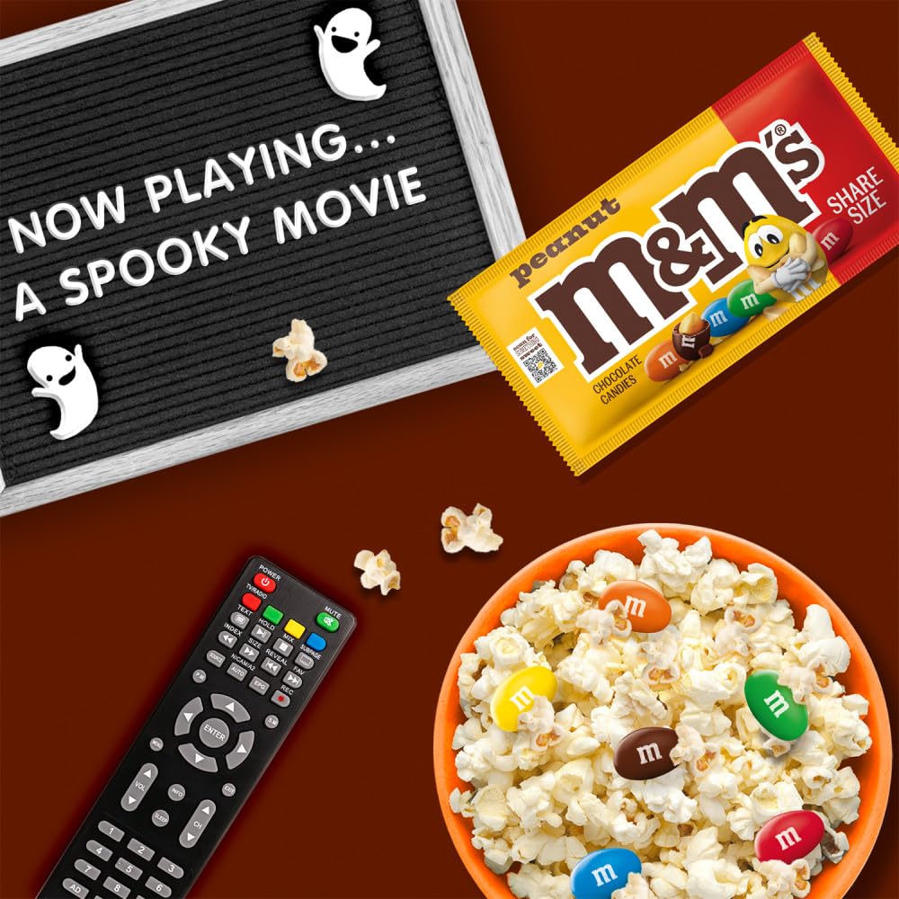 M&M'S pack held in hand showing king-size scale for portion planning