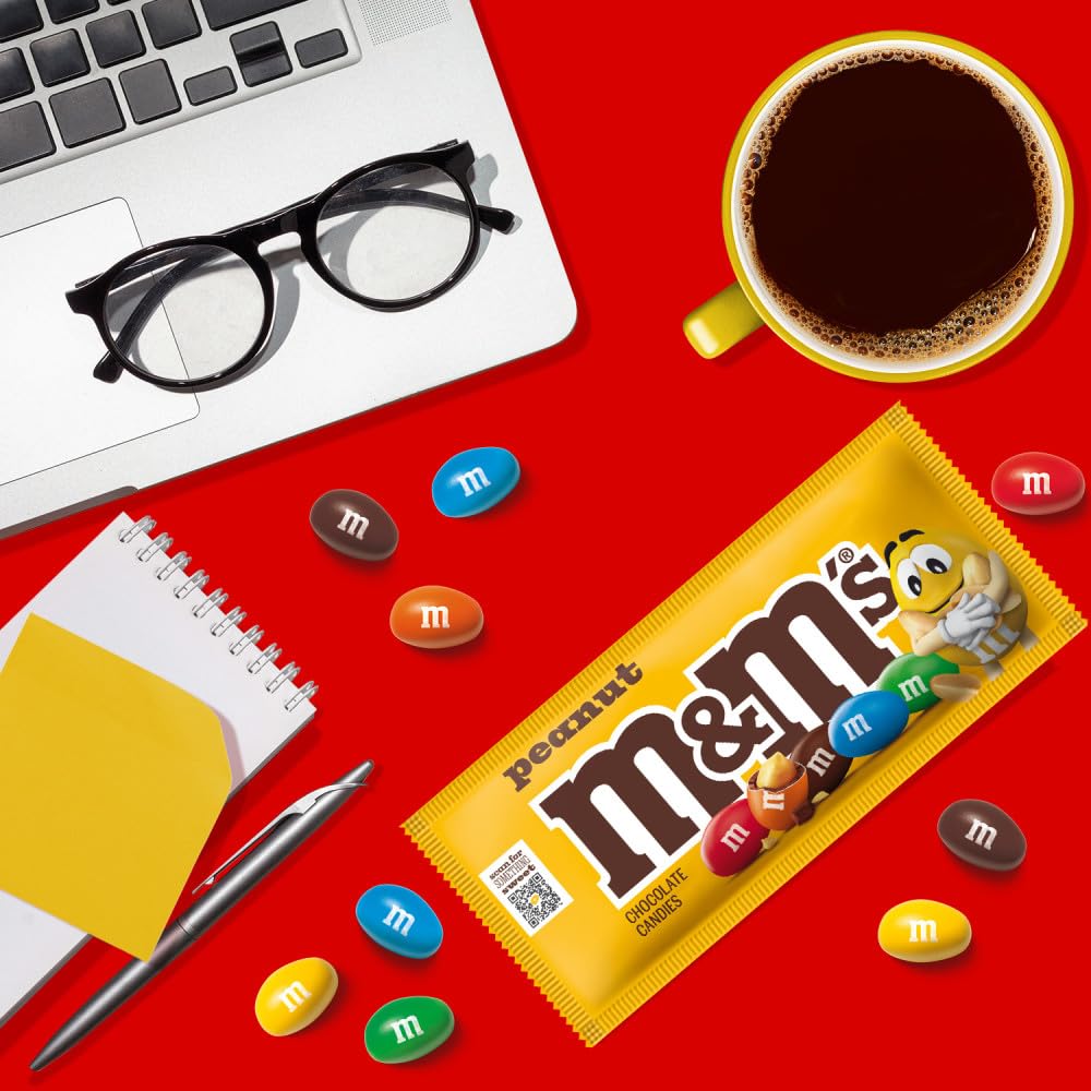 M&M'S single bag next to a ruler for scale, handy portion control benefit