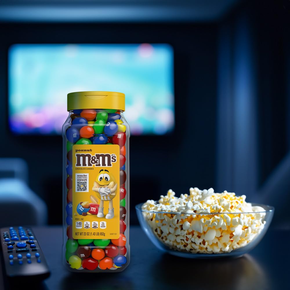 M&M's jar held in hand to show scale and portable snack convenience