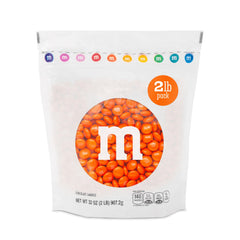 M&M’S WORLD front packaging showing bright orange candies and resealable bag benefit