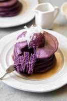Mochi Foods stack of ube pancakes served with syrup benefit: appealing breakfast presentation