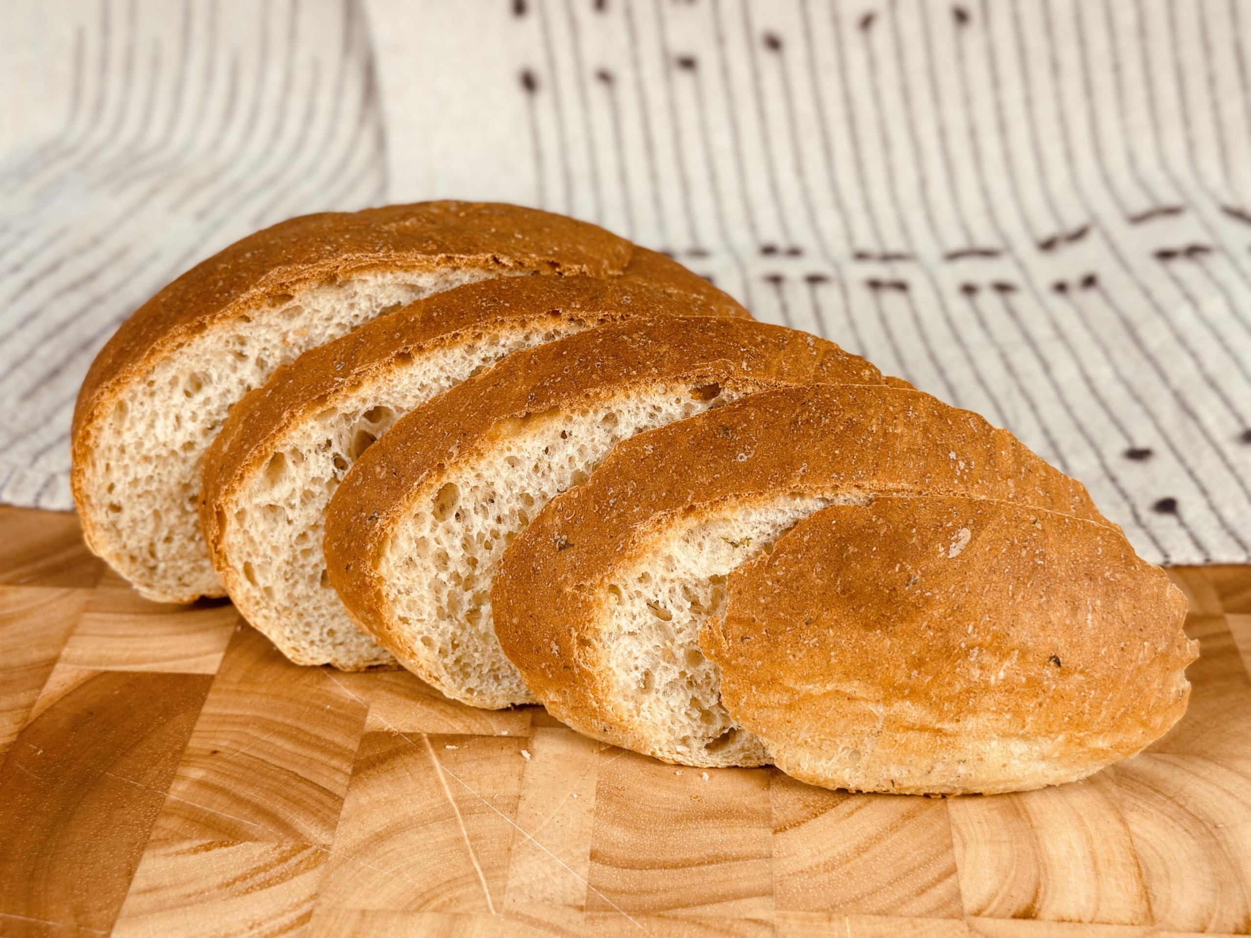 Sliced Molibake potato loaf on cutting board showing soft texture and usable slices