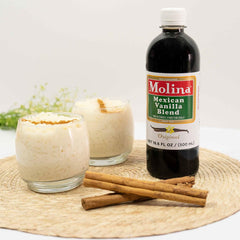 Molina vanilla blend next to measuring cup showing bottle size and portioning ease