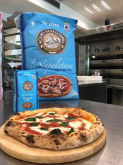 Molino Dallagiovanna pizza baking in wood oven producing rapid oven spring
