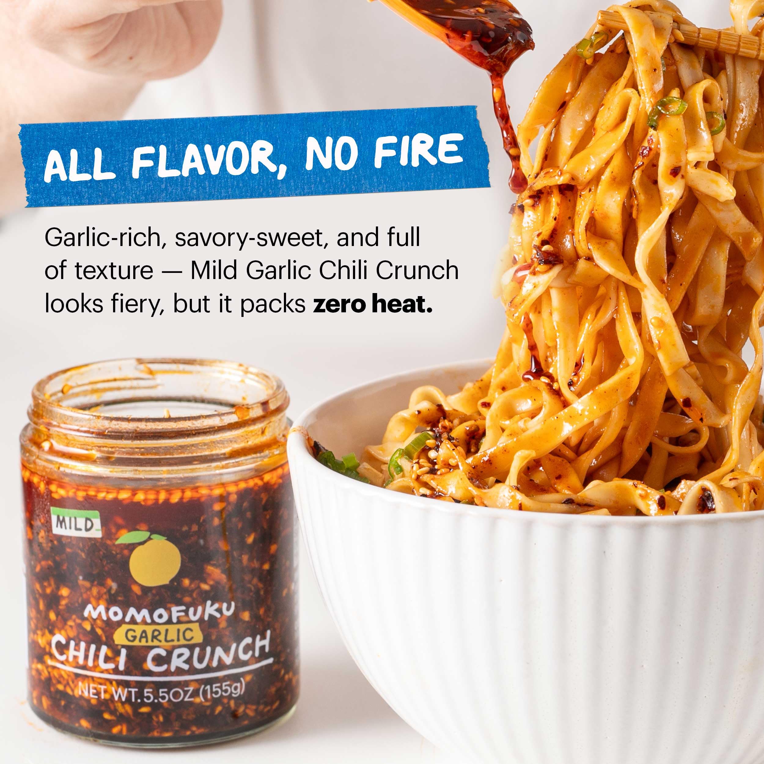 MOMOFUKU spoonful of chili crunch over a bowl, ready-to-use serving convenience