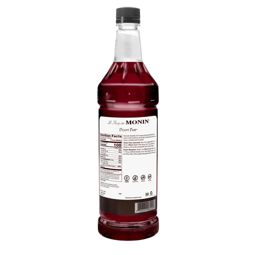 Monin Desert Pear pouring into glass shows vivid fuschia color and enhances drink presentation