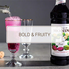 Stream of Monin Desert Pear syrup pouring into a glass for precise dosing