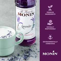 Monin lavender syrup beside a measuring cup showing 1L scale for volume and professional use