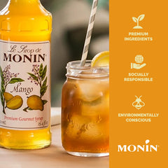Monin mango syrup next to a measuring cup to show 1L scale and convenience