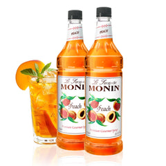Monin peach syrup front view showing two 1L bottles and clear label benefits