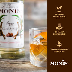 Monin bottle beside measuring scale for precise recipe consistency