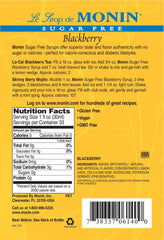 Monin bottle beside a measuring jigger showing 1L scale and ingredient label clarity